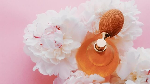 Citrus perfume bottle with peony flowers, chic fragrance scent as luxury cosmetic, fashion and beauty product backgrounds