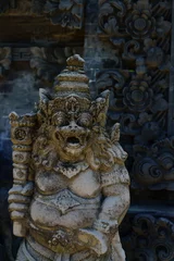 Fotobehang Ancient Balinese statue at the temple © Netfalls
