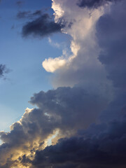 Fototapeta na wymiar Dark rainy clouds in blue sky
