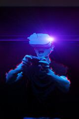 Man with virtual reality headset is playing game. Image with glitch effect.