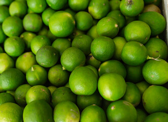 green limes in the fruit market.