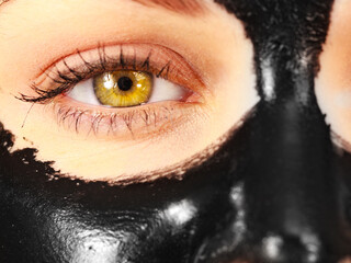 Girl black carbo peel off mask on face