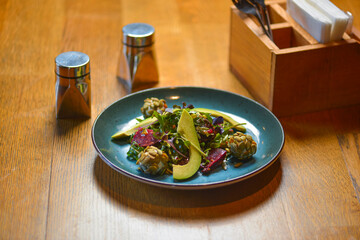 Avocado salad with lemon and fresh sunflower seeds and sprouts. Lenten meal. Fresh organic vegetables.