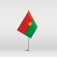 Burkina Faso flag state symbol isolated on background national banner. Greeting card National Independence Day of the Republic of Burkina Faso. Illustration banner with realistic state flag.