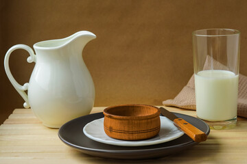 Breakfast dishes - milk jug, glass, plates, knife