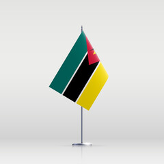 Mozambique flag state symbol isolated on background national banner. Greeting card National Independence Day of the Republic of Mozambique. Illustration banner with realistic state flag.