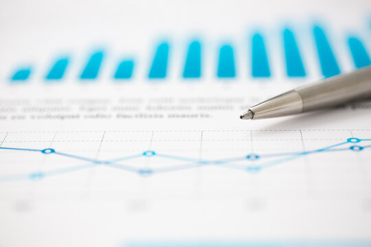 Financial statistics documents ball pen infographics at office table closeup. Internal Revenue Service inspector sum check, investigation, exchange market, earnings, savings, loan and credit concept