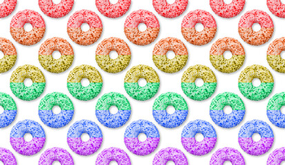 Donut pattern LGBT flag color on a white background, dessert. Sweet pastry colored donut top view, junk food, comfort food