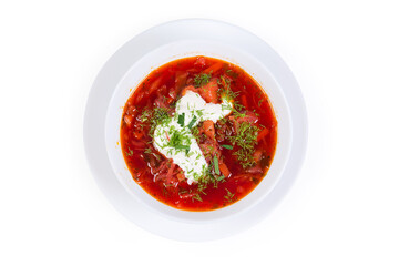 Red beetroot borscht with sour cream in bowl, top view