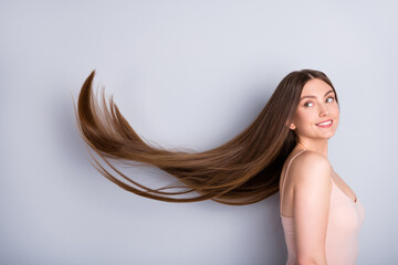 Profile photo of attractive model lady look demonstrate ideal neat long healthy hairstyle flying on...