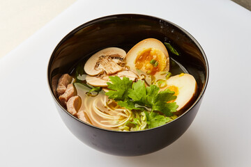 Japanese ramen soup with pork, egg, chives  - traditional Asian dish