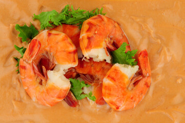 Cooked king tiger prawns with a Marie Rose sauce background