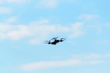  The drone on the background of blue sky