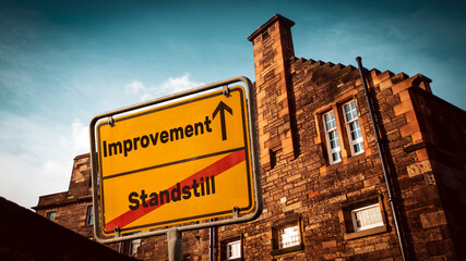 Obraz premium Street Sign to Improvement versus Standstill