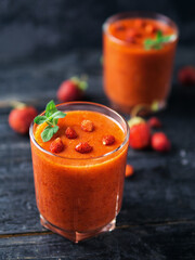 Smoothies with red summer strawberries and raspberries
