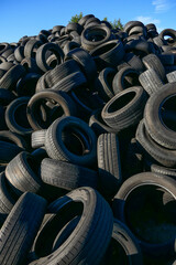 Obraz premium Haparanda, Sweden June 17, 2020 A stack of used automotive tires. no logo