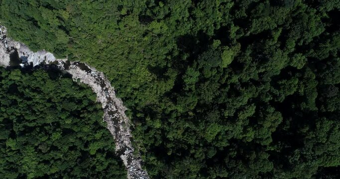 Aerial view waterfall in deep tropical forest mountain green tree