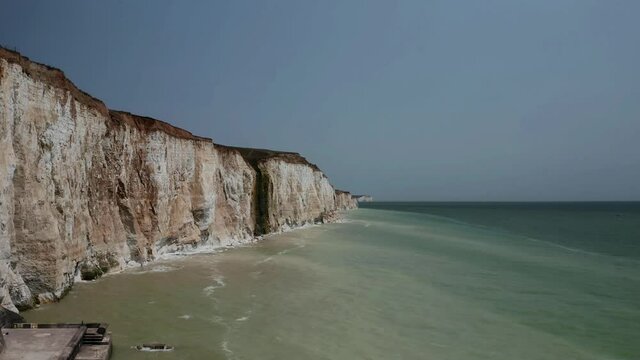 Aerial views along White Cliffs in Southern England in East Sussex Peacehaven, beautiful footage of the dramatic cliffs and English Channel. 
