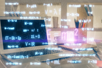 Desktop computer background and formula hologram writing. Double exposure. Education concept.