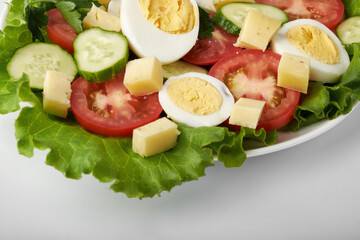 healthy food, cabbage salad with tomatoes, egg and cheese.
