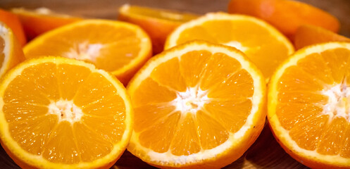 Bunch of fresh sliced oranges on a tray
