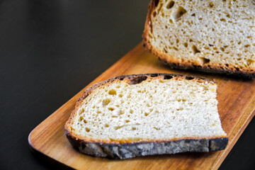 Traditional French country bread slices on a cutting board