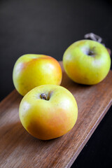 Apples on wooden cutting board