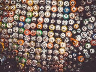 Old used batteries group. Top view background texture