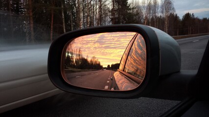 rearview car driving mirror view forest road