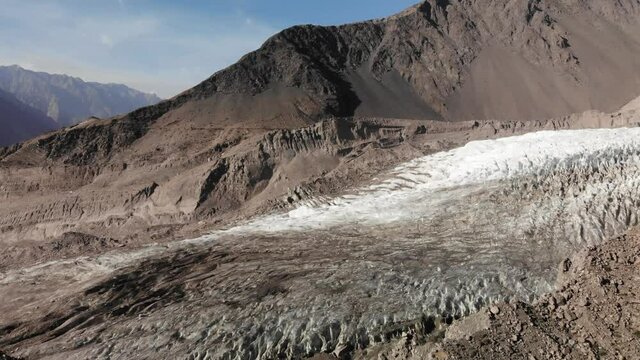 Down-looking view of the Passu glacier near the Hunza valley and Passu village, amazing trekking spot, Gilgit Baltistan region, Karakorum range, Pakistan 