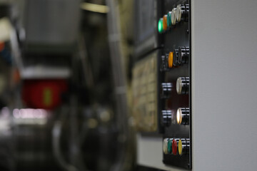 Close up of electrical panel and stop botton switch in control room. Equipment start and shutdown buttons. Industry concept. Copy space