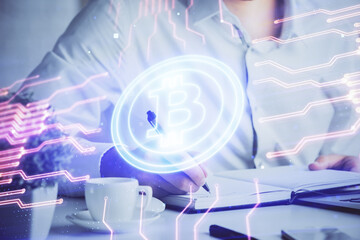 Man's hands working with notes background. Cryptocurrency and finance concept.