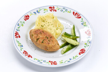 cutlet with mashed potato and cucumber