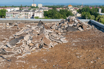 Roof repair, concrete ruins of old roof apartament