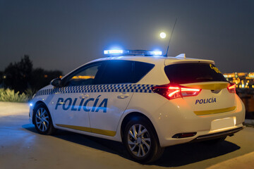 police car with the city of madrid in the background © Aitana fotografia