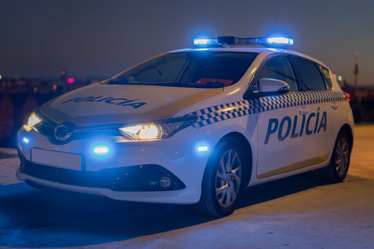 police car with the city in the background