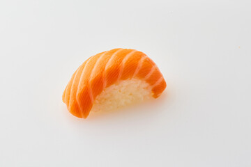 Classic sushi with salmon on white background. Traditional Japanese cuisine