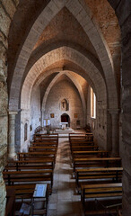 Fototapeta na wymiar Interior of a medieval church with the altar in the background