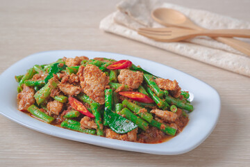 Stir fried pork with yard long bean and red curry paste, Thai food