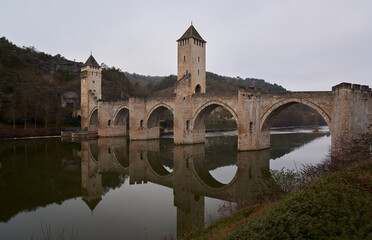 Fototapeta na wymiar Medieval bridge across the river lot