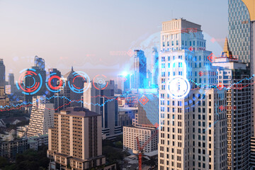 Hologram of Padlock on sunset panoramic cityscape of Bangkok, Asia. The concept of cyber security intelligence. Multi exposure.