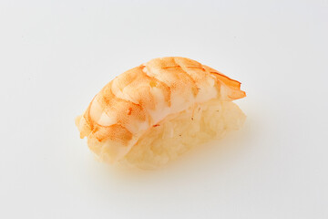 Classic sushi with shrimp on white background. Traditional Japanese cuisine