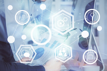 Social network theme hologram with businessman working on computer on background. Multi exposure.