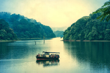 A scenic view of a tourist boat on lake at Periyar national park