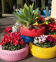 creative made flower bed as a decoration of colored auto tires