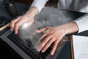 Man using computer. Hands typing laptop. Double exposure with planet earth map hologram. Close up. International eco system concept.