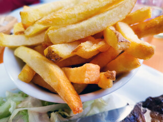 Golden French fries potatoes ready to be eaten