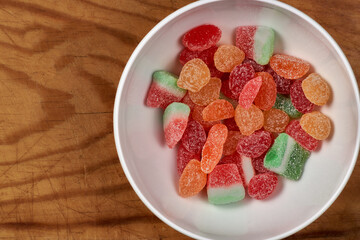 Bowl of jelly beans on a wooden board