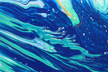 art photography of abstract marbleized effect background. Blue and gold creative colors. Beautiful paint.