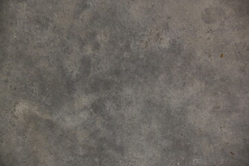 fondo abstracto con manchas grises sobre suelo de cemento